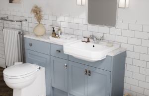 New England bathroom furniture in a chalky blue colour, with an integrated basin and toilet
